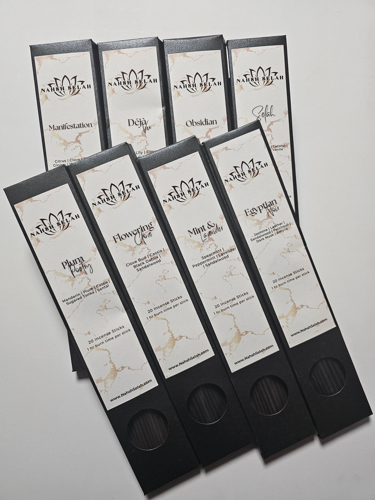 Boxes of incense sticks on a light gray background
