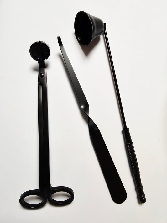 Three black metal tools on a white background